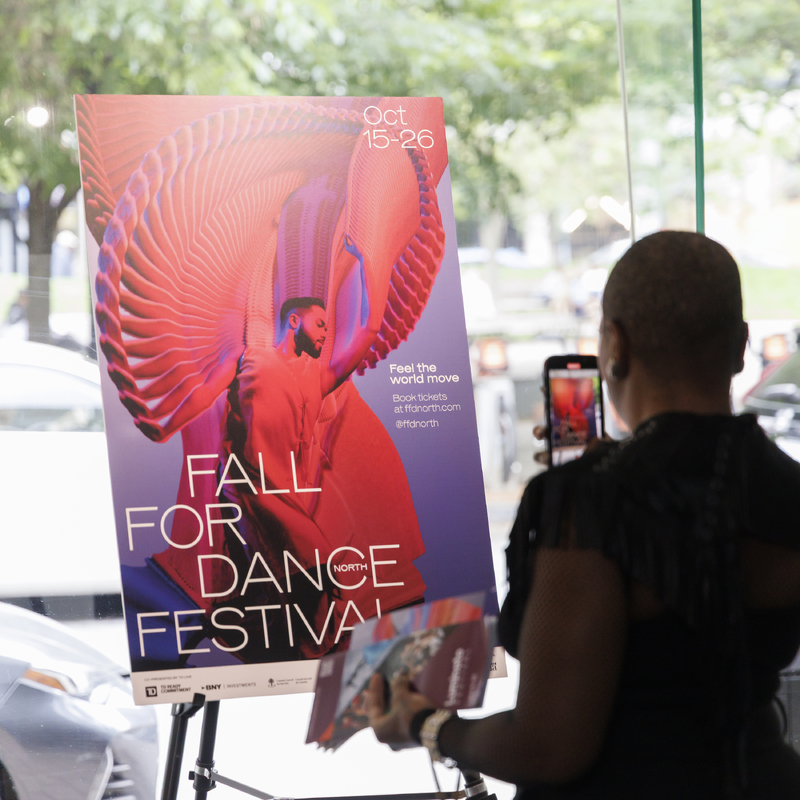 person looking at poster